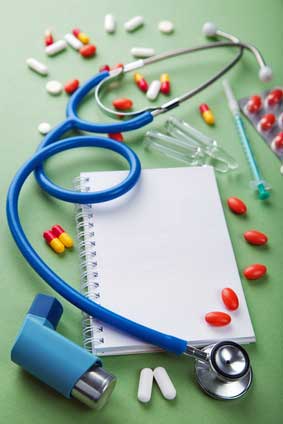 stethoscope, pills and sheet of paper