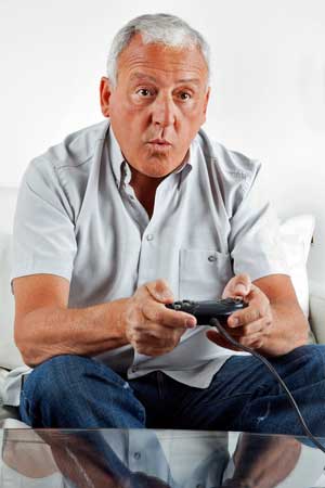 elderly person with video game