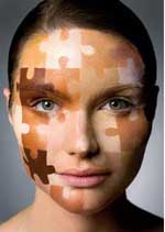 female with puzzle pieces on face
